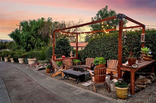 patio terrace at dusk with an outdoor fire pit