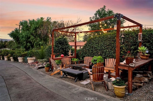 patio terrace at dusk with an outdoor fire pit