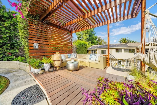 wooden deck featuring a pergola and outdoor lounge area