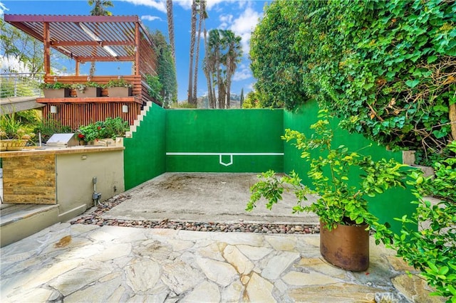 view of patio featuring area for grilling and a pergola