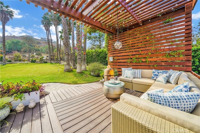 wooden terrace with a pergola, a mountain view, outdoor lounge area, and a yard