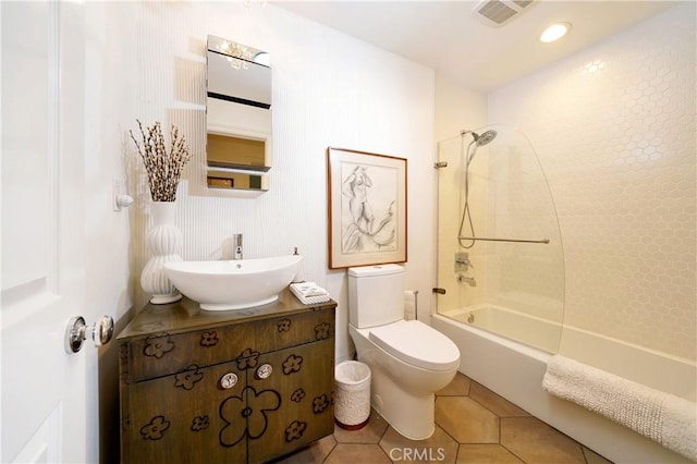 full bathroom featuring toilet, vanity, tile patterned floors, and shower / bathing tub combination