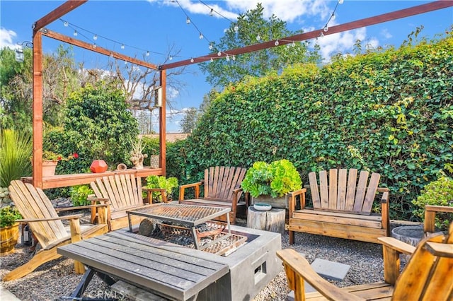 view of patio / terrace featuring a fire pit