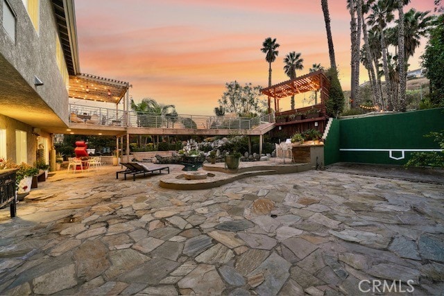 view of patio terrace at dusk