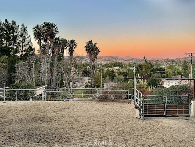 view of yard at dusk