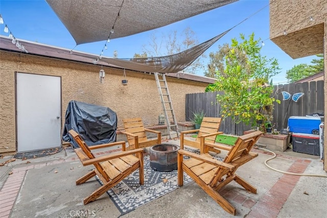 view of patio featuring a grill