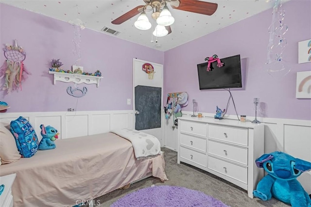 bedroom featuring ceiling fan and light colored carpet