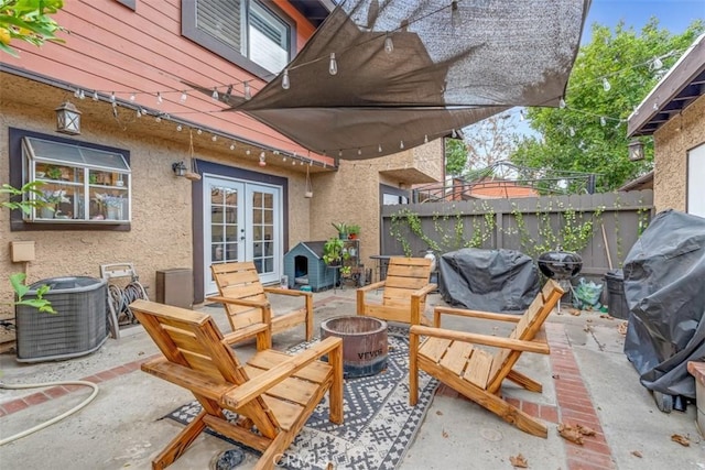 view of patio / terrace featuring central AC unit, grilling area, and french doors