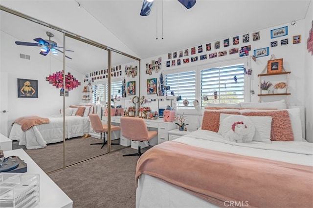 bedroom with ceiling fan, carpet flooring, a closet, and vaulted ceiling