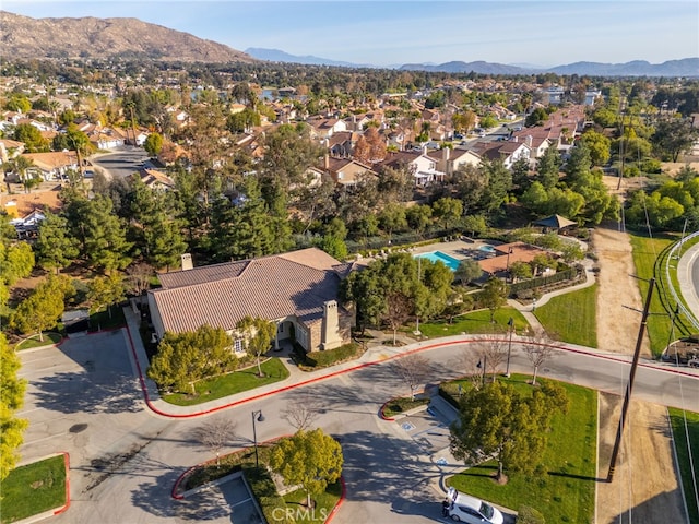 birds eye view of property with a mountain view