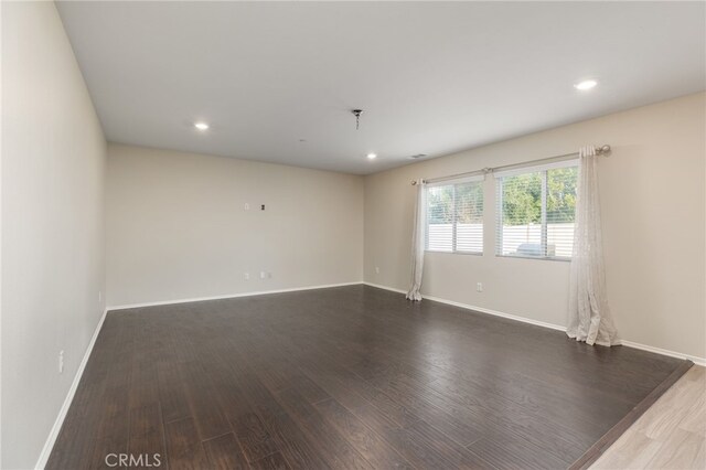 empty room featuring dark hardwood / wood-style floors