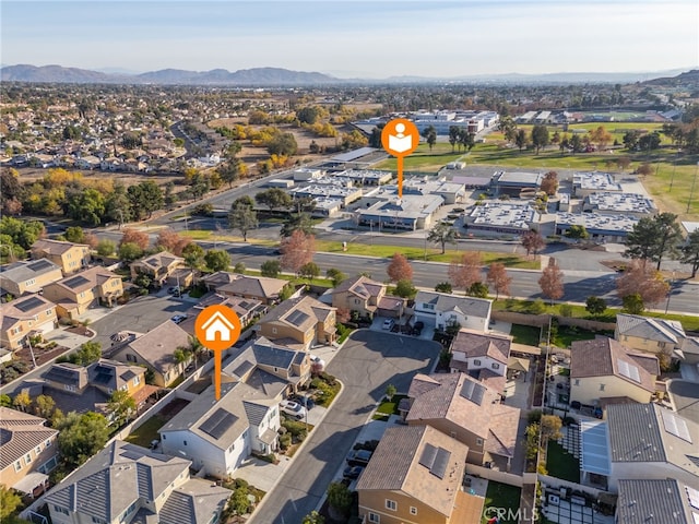 birds eye view of property featuring a mountain view