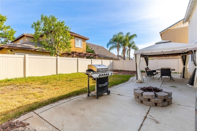 view of patio featuring a gazebo, grilling area, and an outdoor fire pit