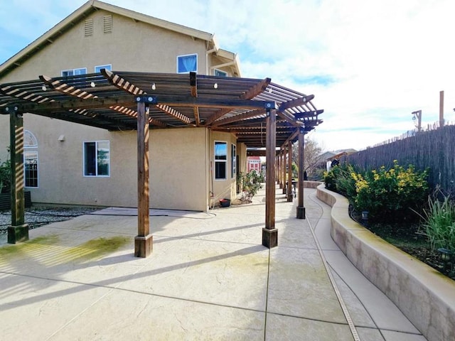 view of patio featuring a pergola