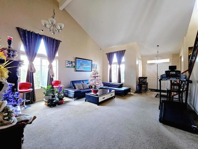 living room featuring high vaulted ceiling, carpet, and an inviting chandelier