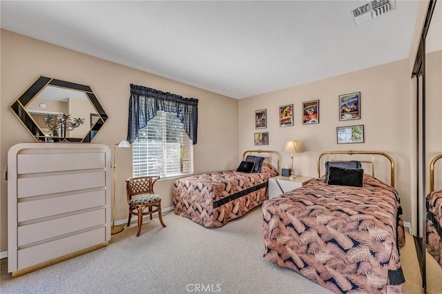 bedroom with light colored carpet