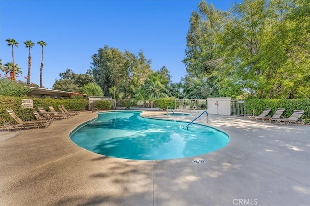 view of swimming pool with a patio