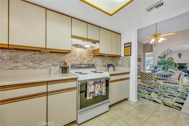 kitchen with light tile patterned floors, ceiling fan, white electric range, and decorative backsplash