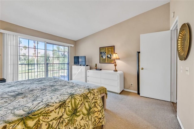 carpeted bedroom with lofted ceiling and access to outside