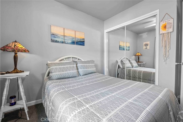 carpeted bedroom with a closet