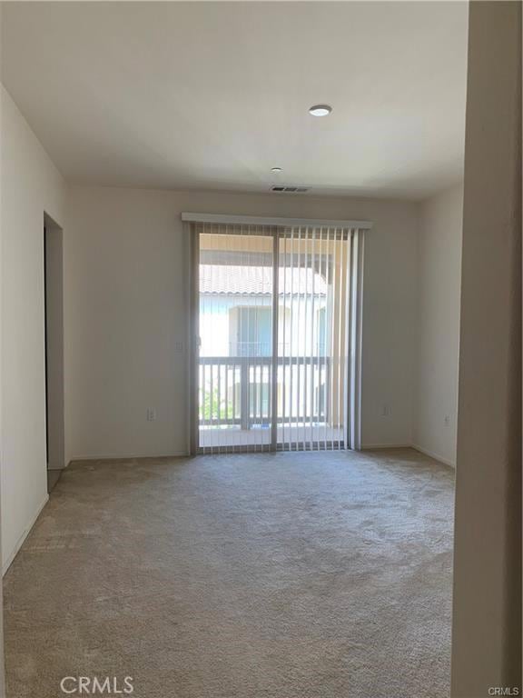 empty room featuring light colored carpet