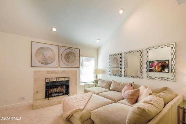 carpeted living room featuring high vaulted ceiling and a fireplace