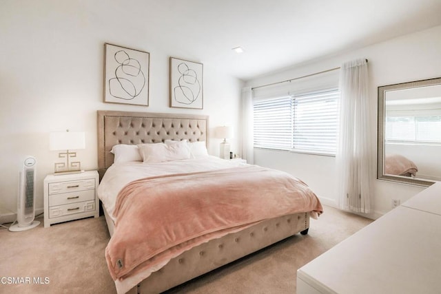 bedroom featuring light colored carpet