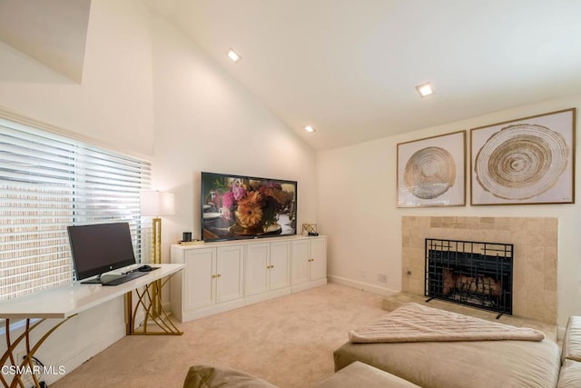 living room featuring high vaulted ceiling, light carpet, and a fireplace