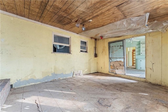 unfurnished room with wooden ceiling