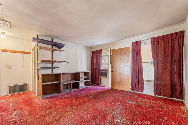 unfurnished living room featuring carpet flooring