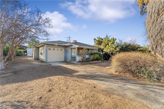 single story home featuring a garage