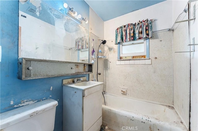 full bathroom with toilet, vanity, and  shower combination