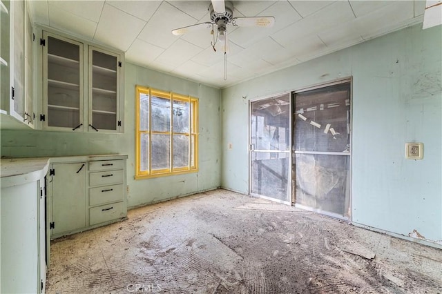 interior space featuring ceiling fan