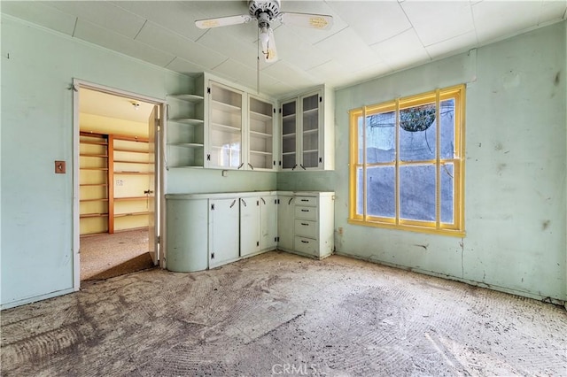 kitchen with light carpet and ceiling fan