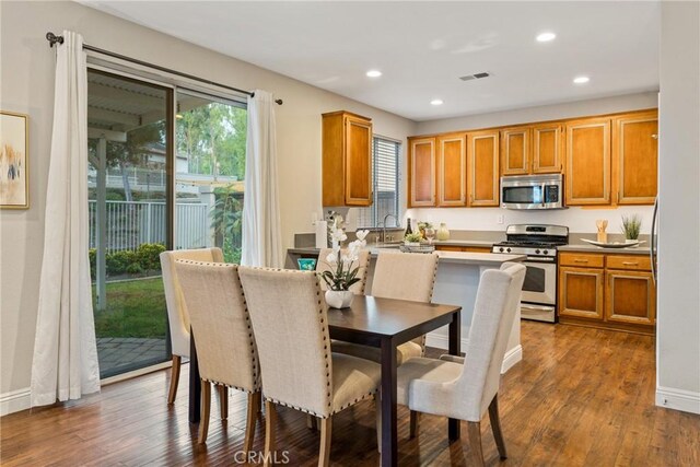 kitchen featuring sink, dark hardwood / wood-style floors, and stainless steel appliances