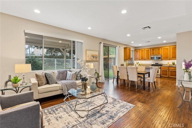 living room featuring dark hardwood / wood-style flooring