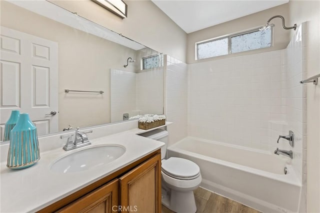 full bathroom featuring toilet, vanity, shower / washtub combination, and hardwood / wood-style flooring