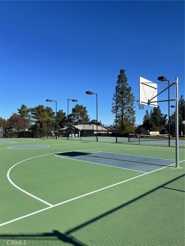 view of sport court with tennis court