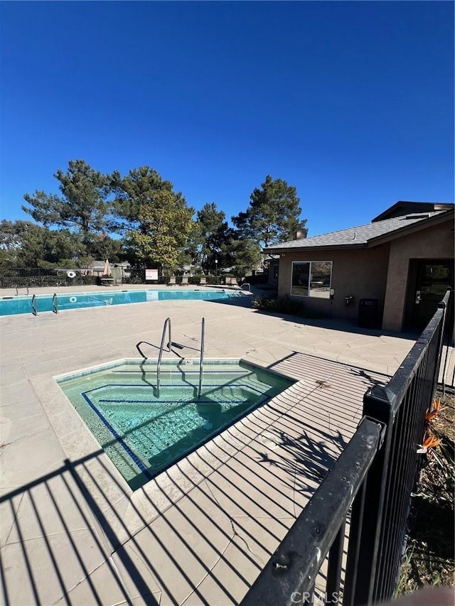 view of pool featuring a patio