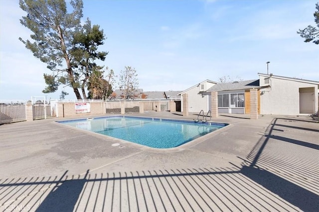 view of swimming pool featuring a patio