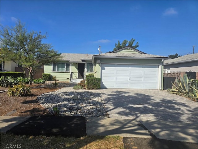 single story home featuring a garage