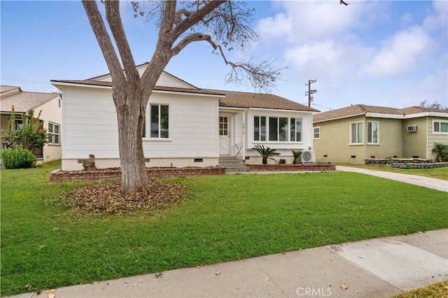 ranch-style house with a front lawn