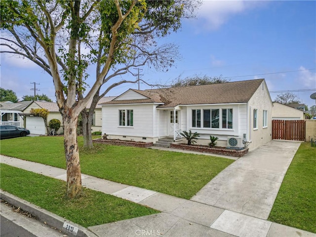 ranch-style house with ac unit and a front lawn