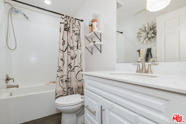 full bathroom with toilet, vanity, and shower / bath combo