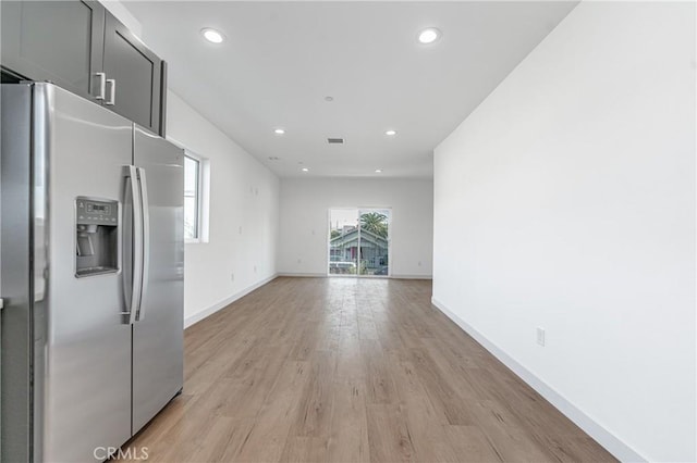 unfurnished living room with light hardwood / wood-style flooring