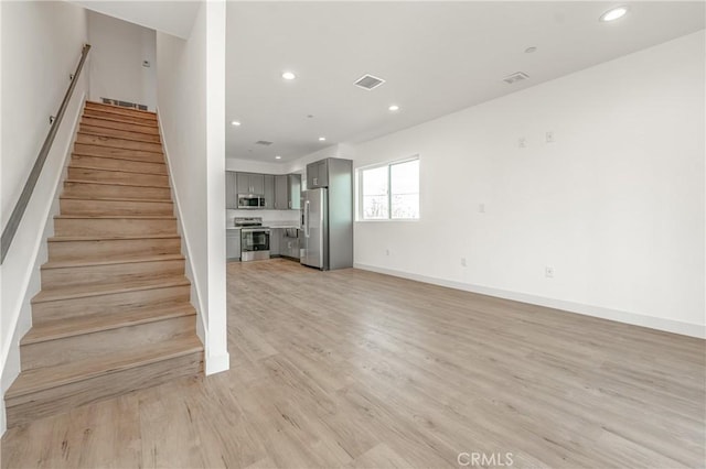 staircase featuring wood-type flooring