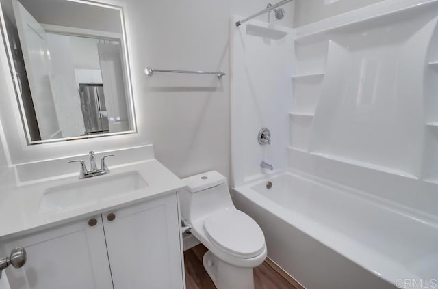 full bathroom with vanity,  shower combination, hardwood / wood-style floors, and toilet