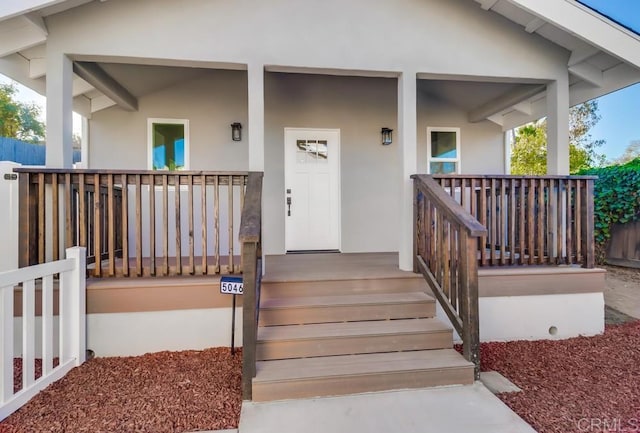 doorway to property with covered porch