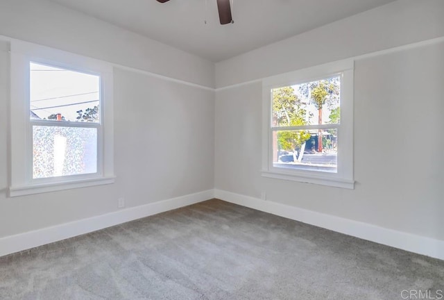 empty room with carpet floors and ceiling fan