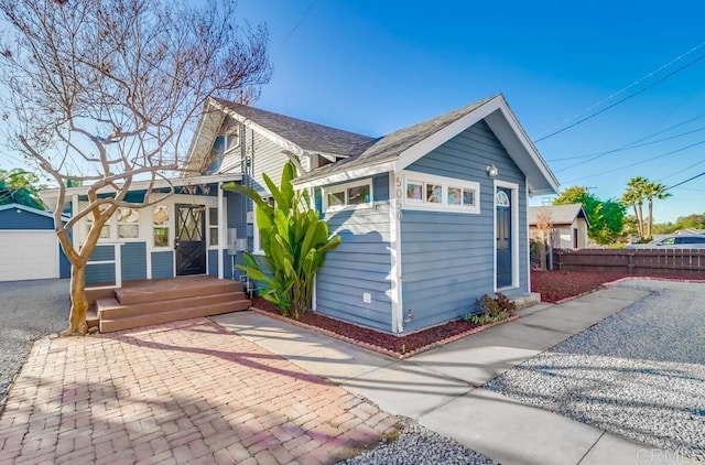 exterior space with an outbuilding and a garage